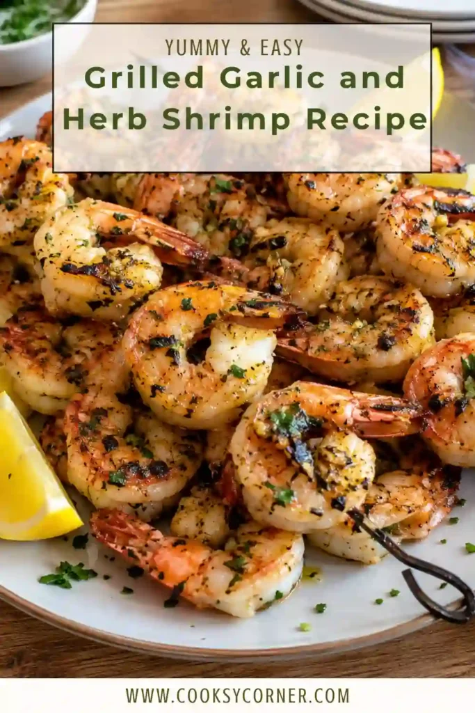 Grilled Garlic and Herb Shrimp arranged with lemon wedges and fresh herbs. The tender shrimp have golden grill marks and a savory coating of garlic, paprika, basil, and Italian seasoning.