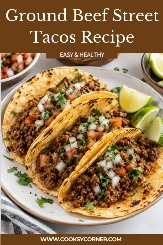 Mexican-inspired street tacos filled with deeply browned ground beef seasoned with cumin, chili powder, lime, and chipotle peppers. Fresh onion, cilantro, and cheese add color and texture.
