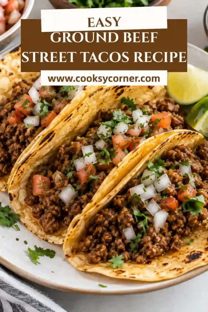 Ground Beef Street Tacos filled with smoky chipotle-seasoned beef, cotija cheese, diced white onion, and fresh cilantro. The small warm tortillas are served with fresh lime wedges.