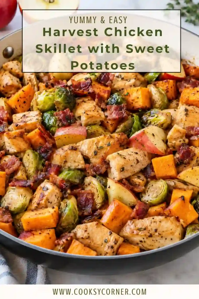 Healthy chicken skillet with sweet potatoes, Brussels sprouts, apples, and herbs served warm in a cast-iron pan. The dish combines savory chicken with naturally sweet seasonal ingredients.