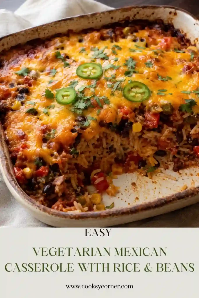 Healthy Vegetarian Mexican Casserole with Rice & Beans featuring brown rice, black beans, corn, red and green peppers, tomatoes, and melted cheese. Fresh cilantro and sliced jalapeños garnish the colorful baked casserole.