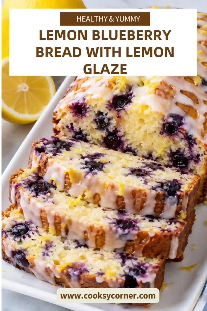 Moist lemon blueberry loaf with blueberries throughout and a sweet lemon glaze dripping over the top. Fresh lemon slices and blueberries surround the homemade quick bread.