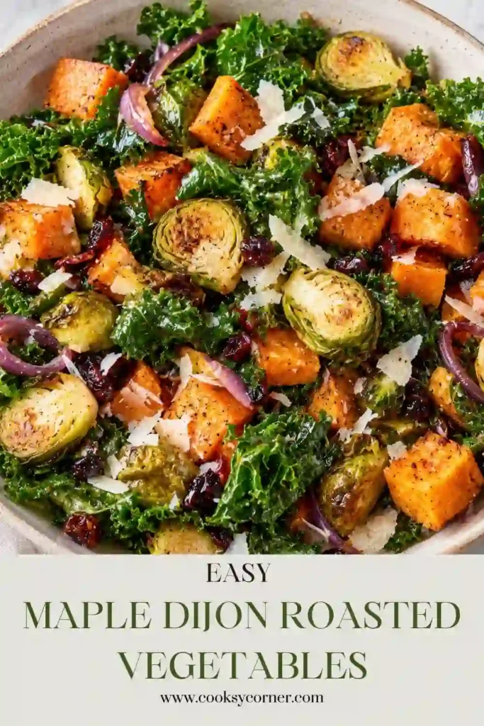 Maple roasted vegetables served warm with a sweet and tangy Dijon glaze. The mixed vegetables are golden and lightly charred around the edges after roasting.