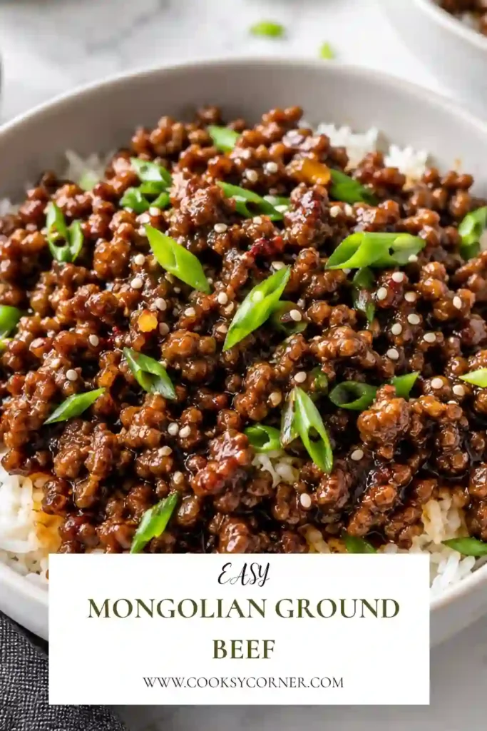 Easy Mongolian ground beef with browned beef, scallions, garlic, and ginger in a rich soy-based sauce. The finished beef is served in a bowl with steamed jasmine rice.