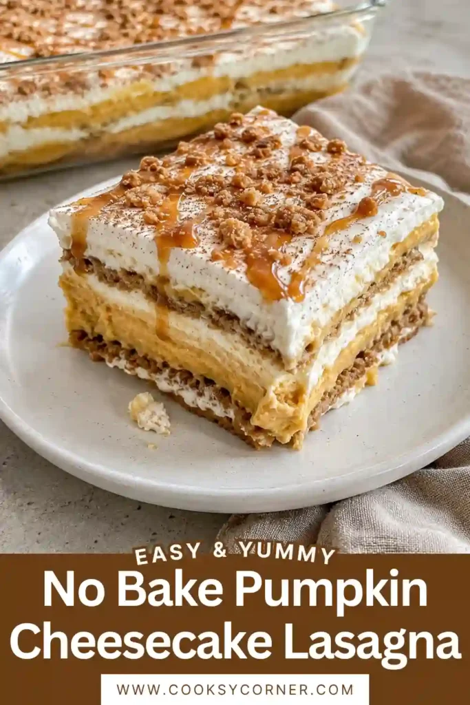 Layered no bake pumpkin dessert featuring cinnamon graham crackers, creamy pumpkin cheesecake filling, fluffy vanilla-maple topping, and caramel. Toffee bits add a crunchy golden finish to the chilled fall dessert.