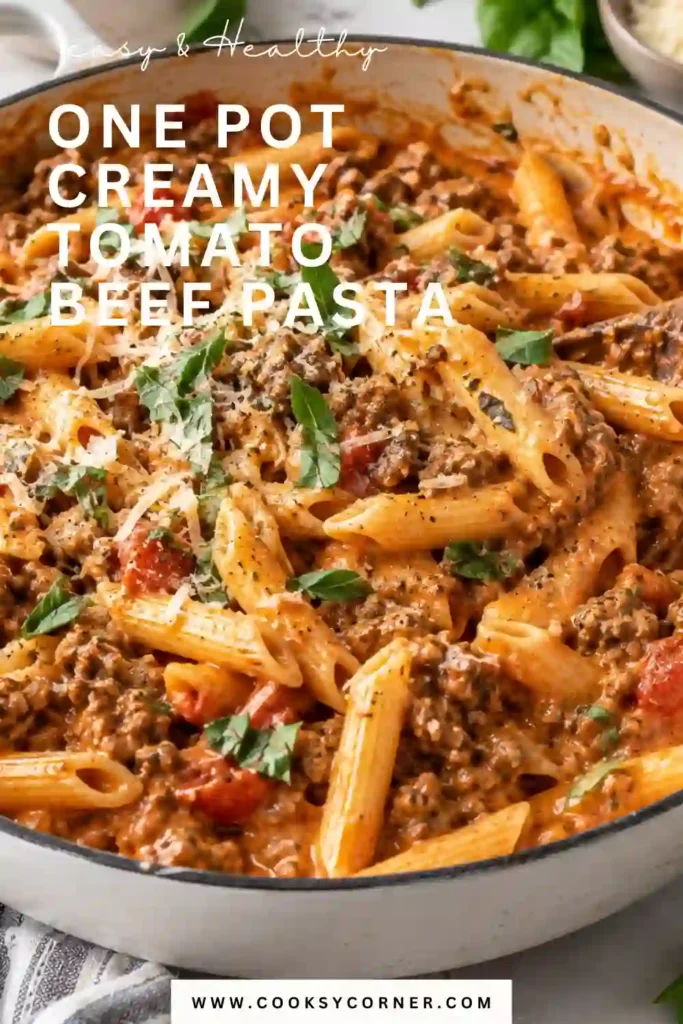 One Pot Creamy Tomato Beef Pasta with tender short pasta and seasoned ground beef coated in a rich tomato cream sauce. Fresh parsley and grated Parmesan finish the comforting pasta dinner.