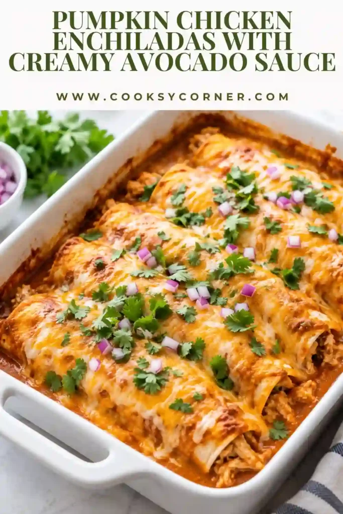 Pumpkin Chicken Enchiladas covered with savory pumpkin sauce and melted Monterey Jack cheese. The enchiladas are garnished with cilantro, green onions, and creamy avocado salsa verde.