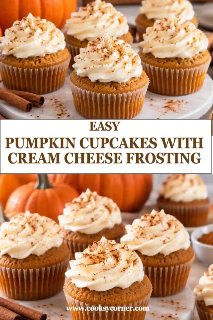 A pumpkin cupcake cut in half reveals a soft, moist orange crumb beneath a generous layer of cream cheese frosting. The close-up highlights the tender texture of the pumpkin spice cupcake.