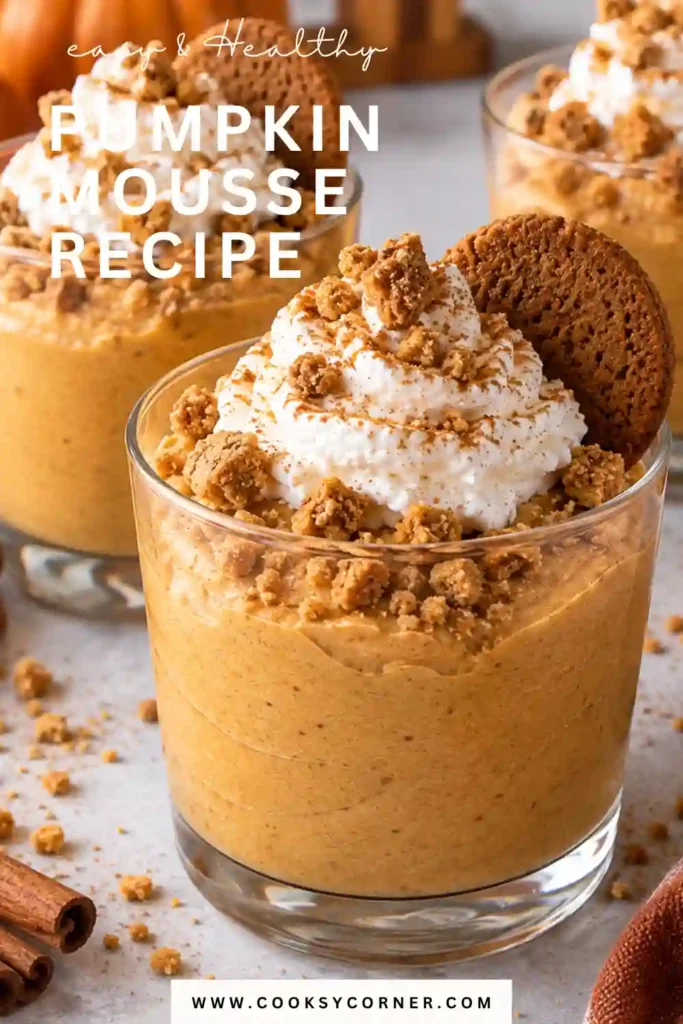 Creamy pumpkin mousse served in a clear dessert glass with whipped cream and cinnamon. This easy no bake pumpkin dessert has a light, fluffy texture and beautiful orange color.