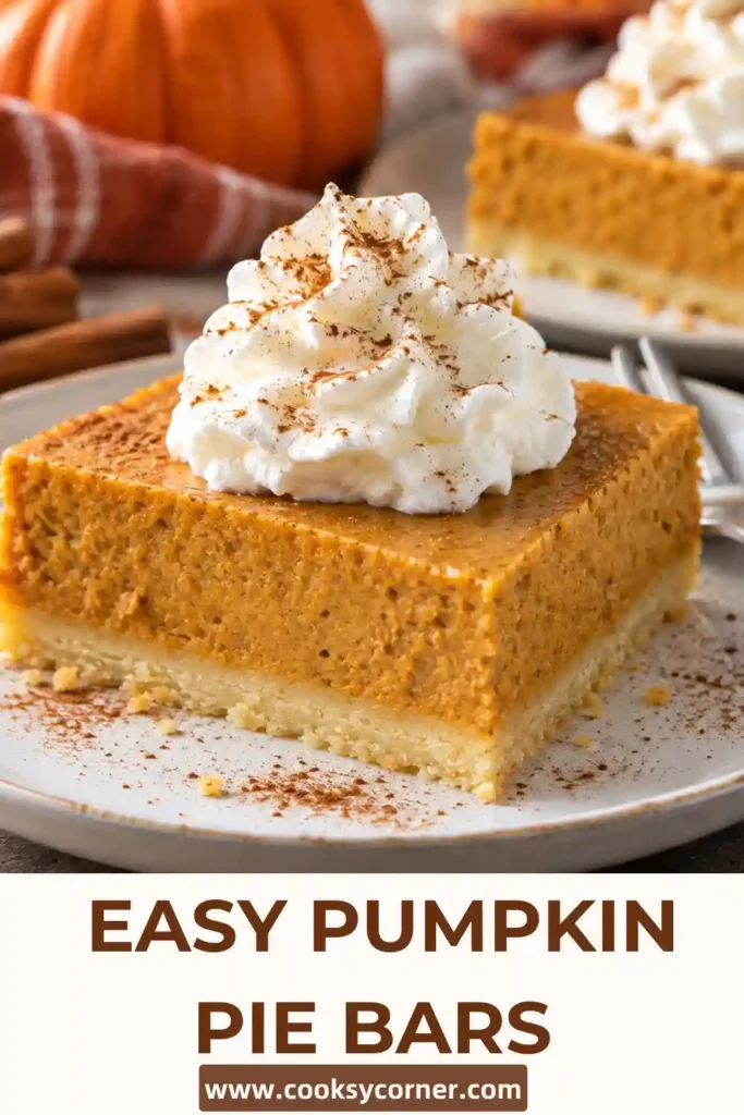Pumpkin pie bars with shortbread crust arranged on a rustic serving plate with whipped cream and cinnamon. The creamy orange pumpkin filling rests on a golden, buttery shortbread base.
