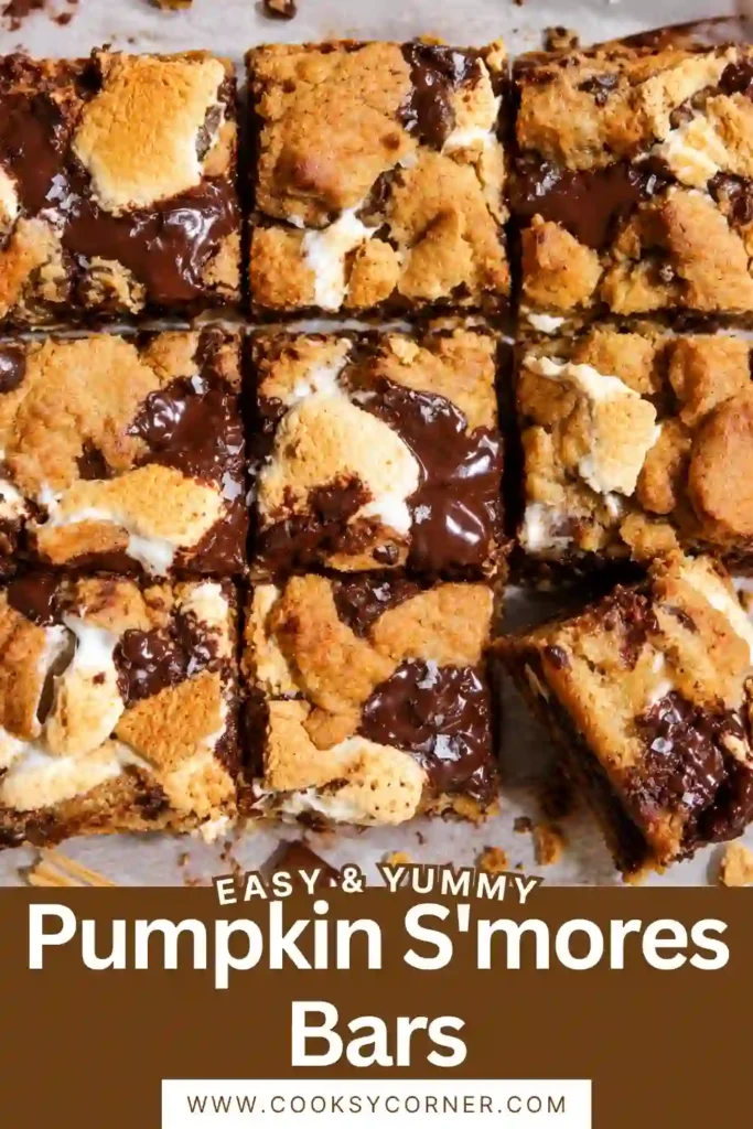 Close-up of pumpkin chocolate marshmallow bars showing melted dark chocolate and gooey marshmallow between layers of chewy pumpkin cookie dough. Graham cracker pieces add a crunchy texture to the rich dessert.