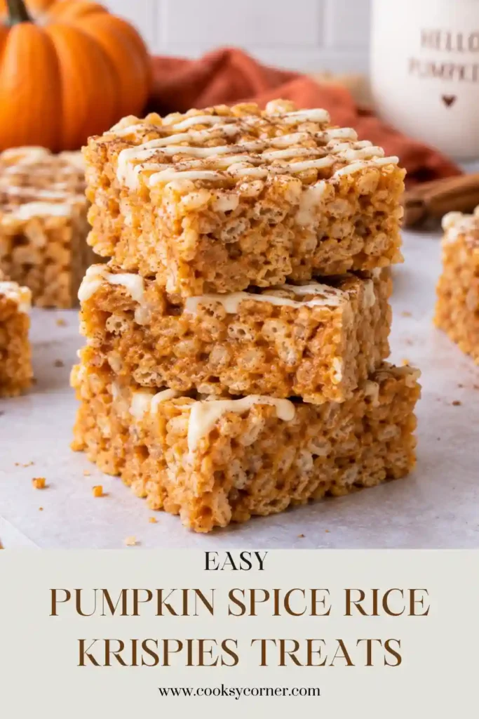 Homemade Pumpkin Spice Rice Krispies Treats arranged on a serving plate for an easy fall dessert. Pumpkin, cinnamon, nutmeg, and marshmallows give the crispy cereal bars a cozy seasonal flavor.