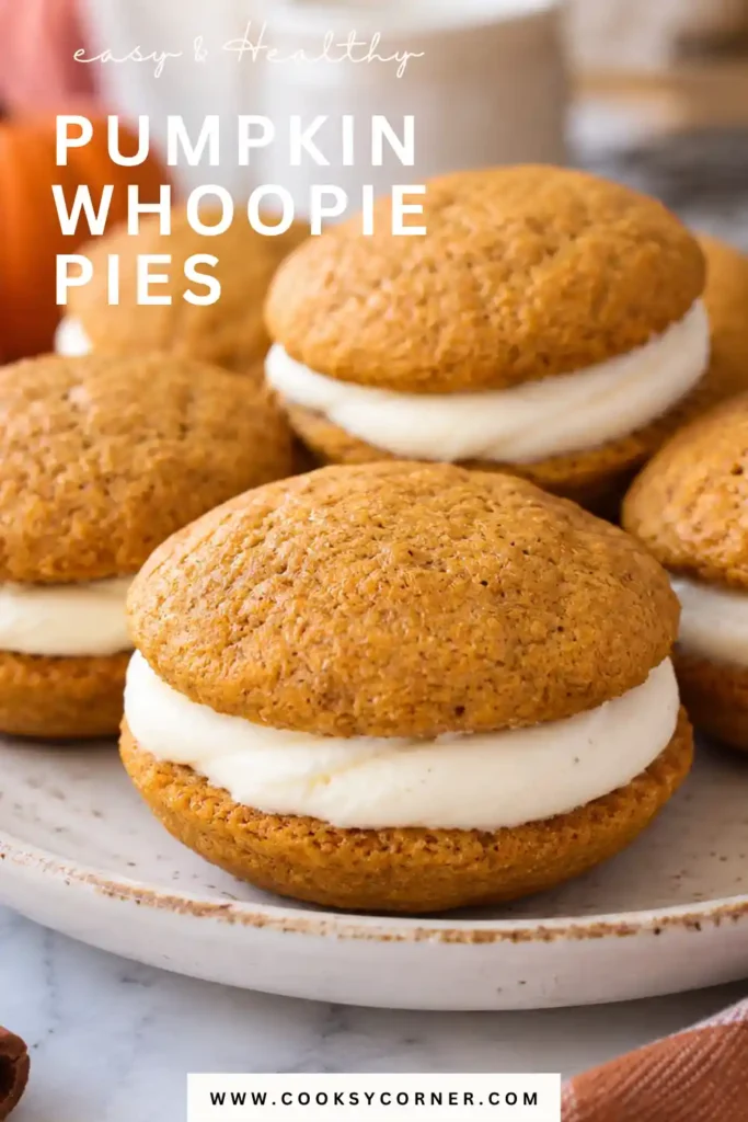 Homemade Pumpkin Whoopie Pies stacked together with thick layers of cream cheese frosting between soft, golden-orange pumpkin cookies. These warmly spiced fall treats have a tender, cake-like texture and creamy filling.