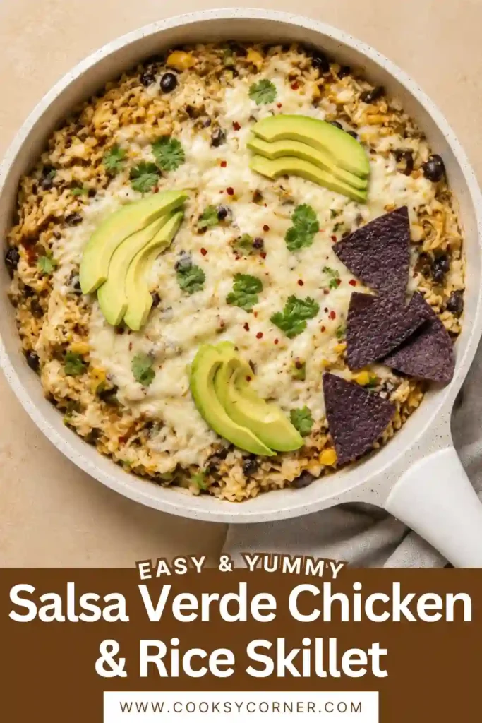 Salsa Verde Chicken & Rice Skillet with shredded chicken, fluffy rice, black beans, roasted corn, green chiles, and melted Monterey Jack cheese. Fresh avocado and cilantro add color to the finished one-pan meal.
