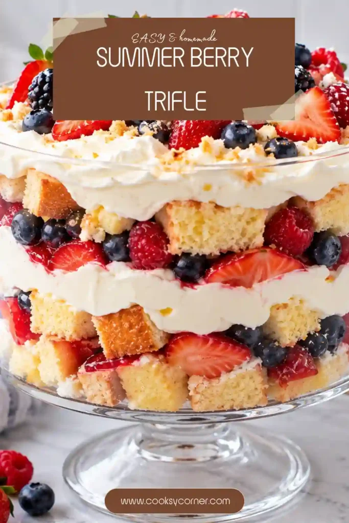 No-bake Summer Berry Trifle featuring layers of jam-coated mixed berries and creamy whipped cream cheese filling. Ladyfingers soften between the vibrant fruit and rich vanilla cream.