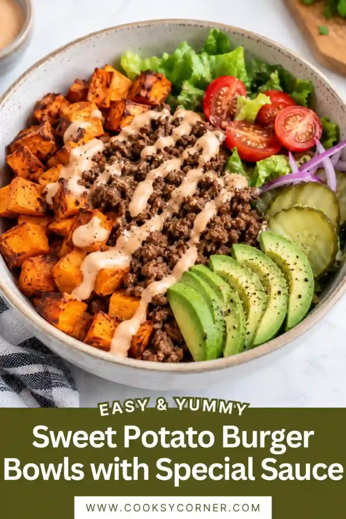 Sweet Potato Burger Bowls filled with seasoned ground beef, roasted sweet potato cubes, shredded lettuce, cherry tomatoes, red onion, and cheddar cheese. Creamy homemade special sauce is drizzled over the colorful burger bowl.