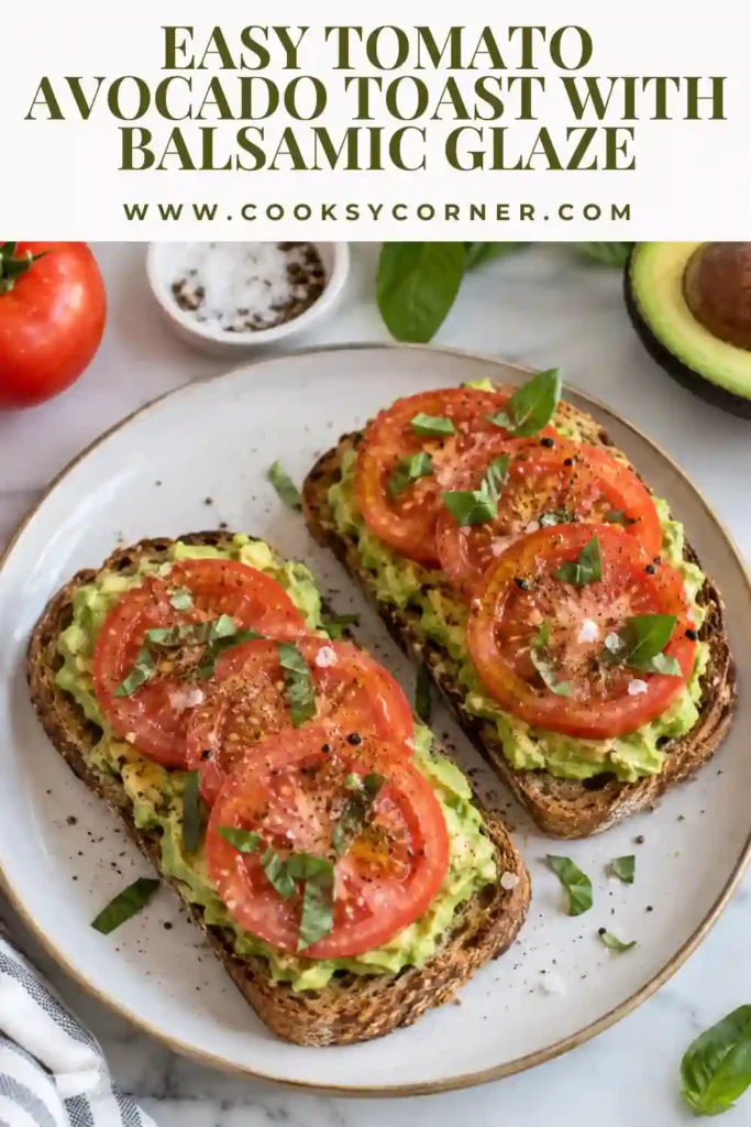 Two slices of tomato avocado toast prepared as individual servings. Each slice is layered with mashed avocado, tomato, shallots, and balsamic glaze.
