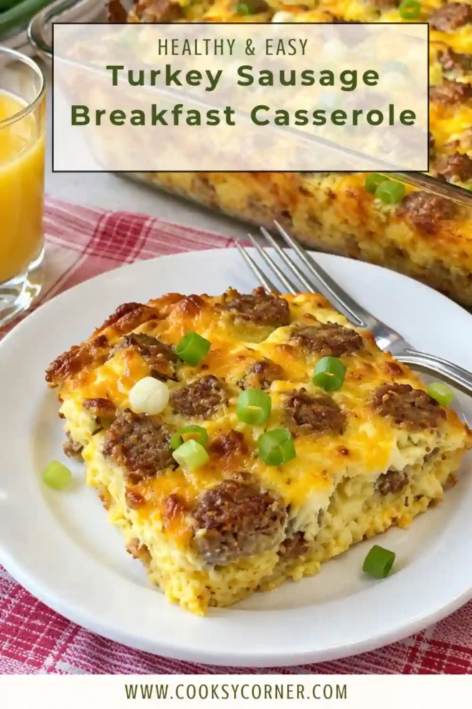 A warm slice of cheesy breakfast casserole made with eggs, halal turkey sausage, cheddar cheese, and toasted bread. The casserole has a tender center and lightly browned top.