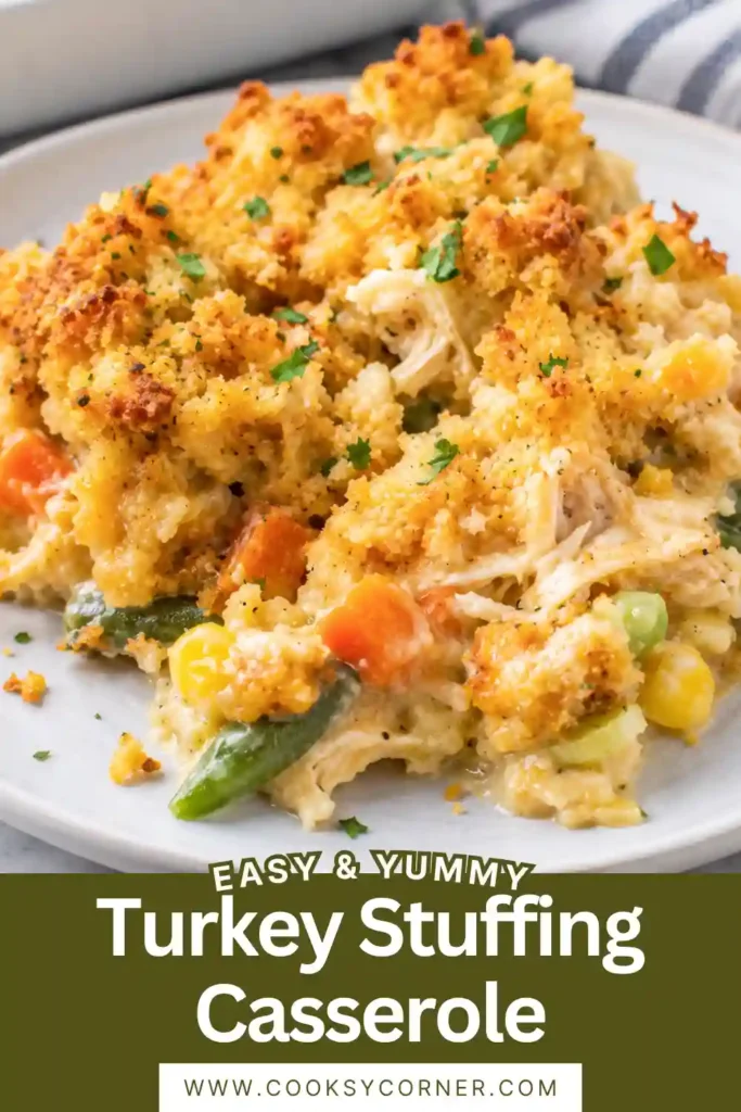 Freshly baked leftover turkey casserole filled with vegetables and topped with fluffy seasoned stuffing. The casserole is golden on top with a warm and creamy center.