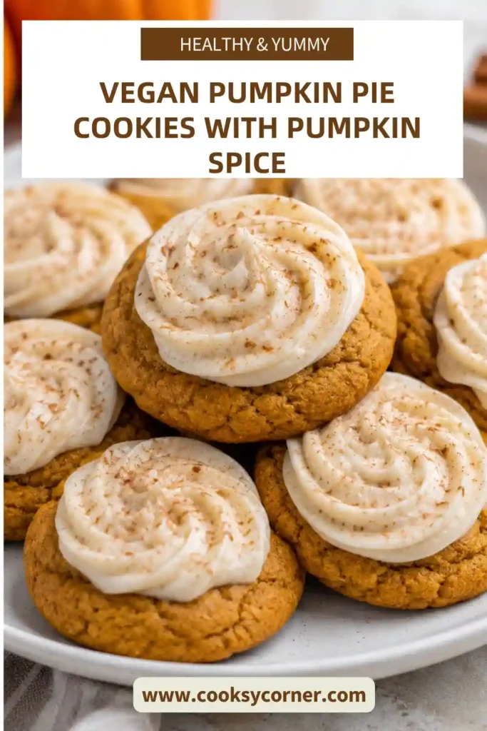 Vegan Pumpkin Pie Cookies with soft pumpkin spice cookie edges and creamy pumpkin centers. Each cookie is finished with vegan whipped cream and a sprinkle of pumpkin pie spice.