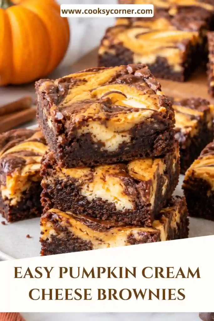 Homemade pumpkin cheesecake brownies featuring a fudgy chocolate base and warmly spiced pumpkin cream cheese layer. Silky ganache adds an extra-rich chocolate finish.
