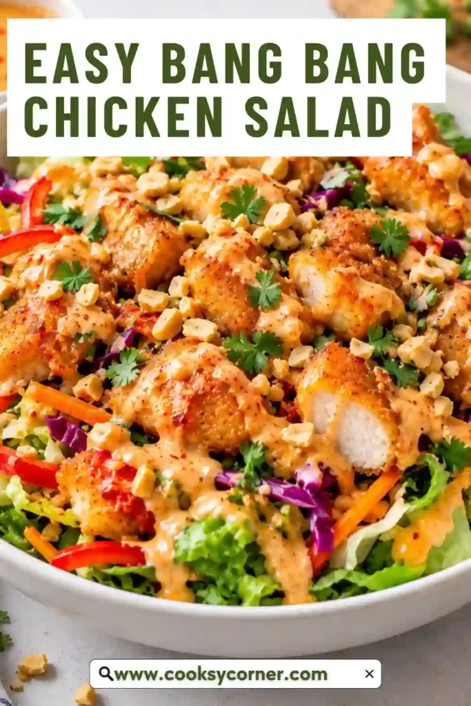 Spicy chicken salad made with shredded chicken breast, carrots, bell peppers, and fresh herbs. The ingredients are coated in a creamy Greek yogurt, sweet chili, and Sriracha dressing.