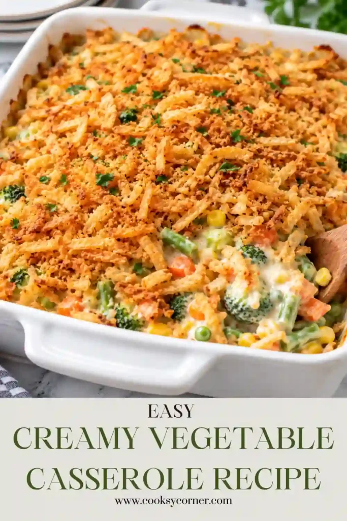 Baked vegetable casserole featuring broccoli, cauliflower, carrots, creamy cheese sauce, and crispy breadcrumbs. The golden topping contrasts with the tender vegetables underneath.