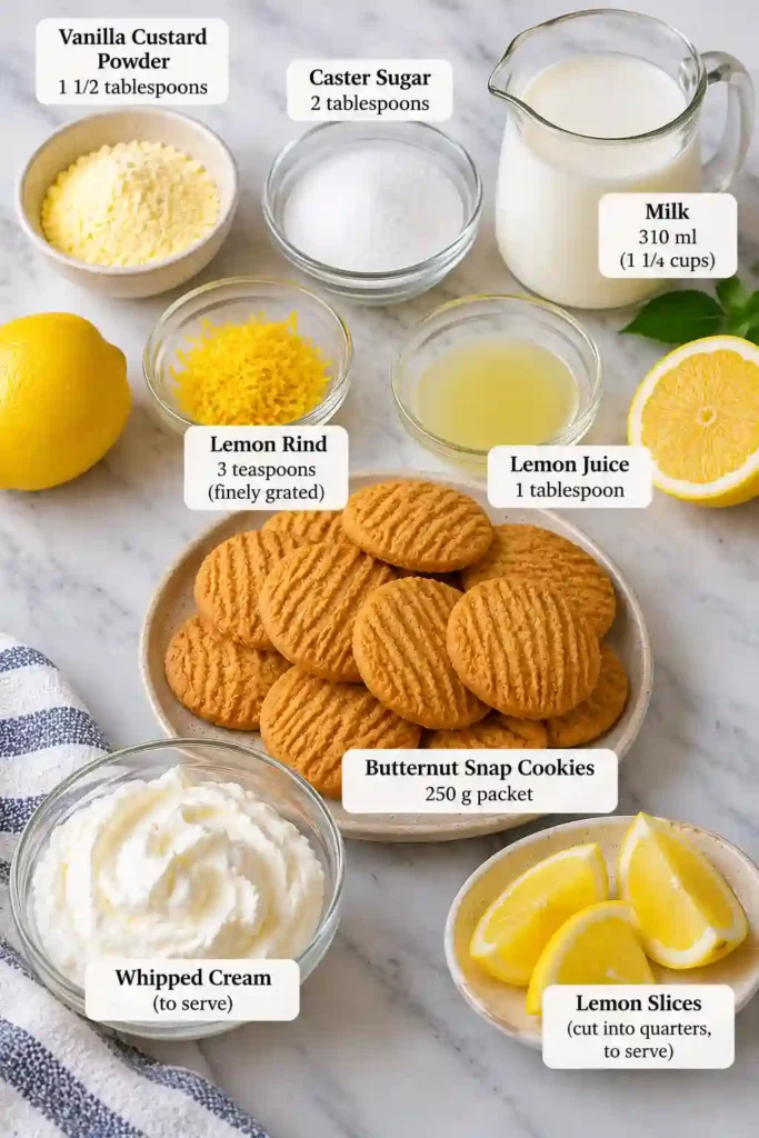Homemade muffin pan lemon tarts featuring crisp cookie shells and silky lemon custard. The bite-sized desserts are finished with fluffy whipped cream and fresh citrus.