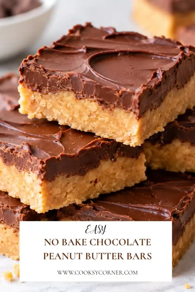 No-Bake Chocolate Peanut Butter Bars with a thick creamy peanut butter base and smooth chocolate topping. The chilled dessert bars are sliced into neat squares to show their distinct chocolate and peanut butter layers.