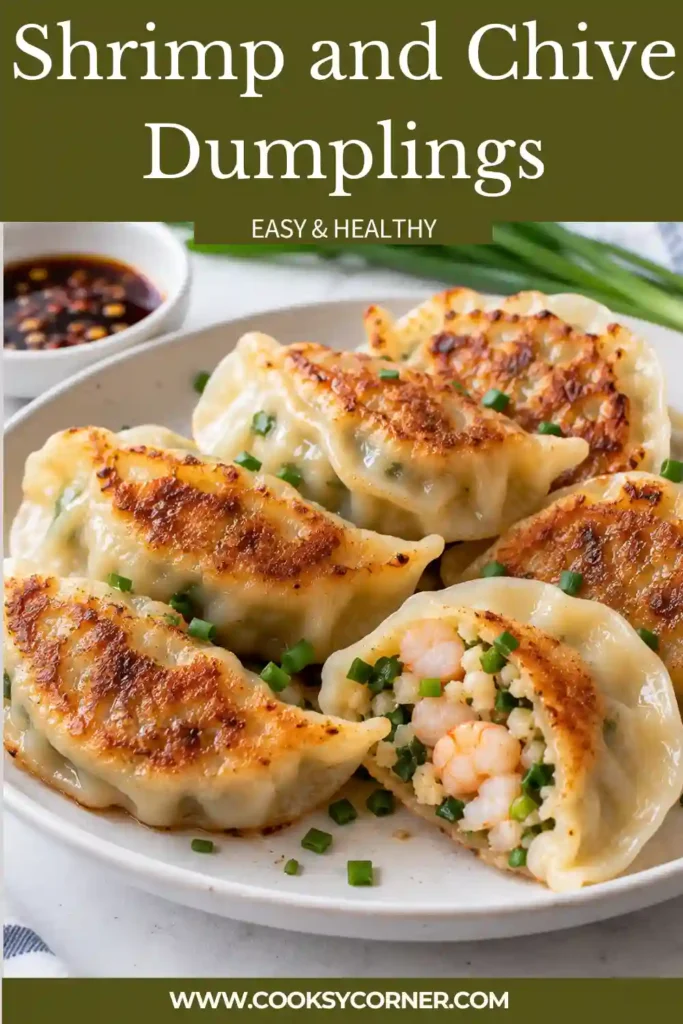 Golden pan fried shrimp dumplings filled with chopped shrimp, fresh chives, and savory seasonings. A dark soy vinegar dipping sauce is served alongside the crispy dumplings.